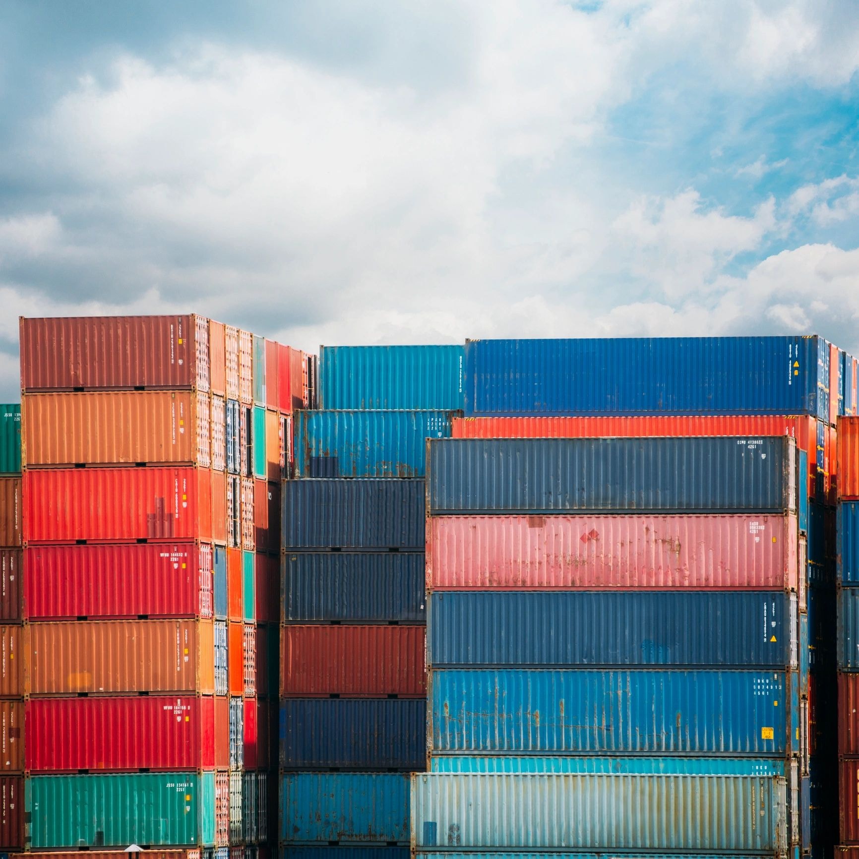 Stacked colourful shipping containers at port